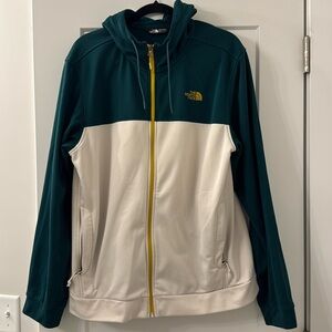 The North Face Men’s size Large hooded zip-up sweater. Green and off white.
